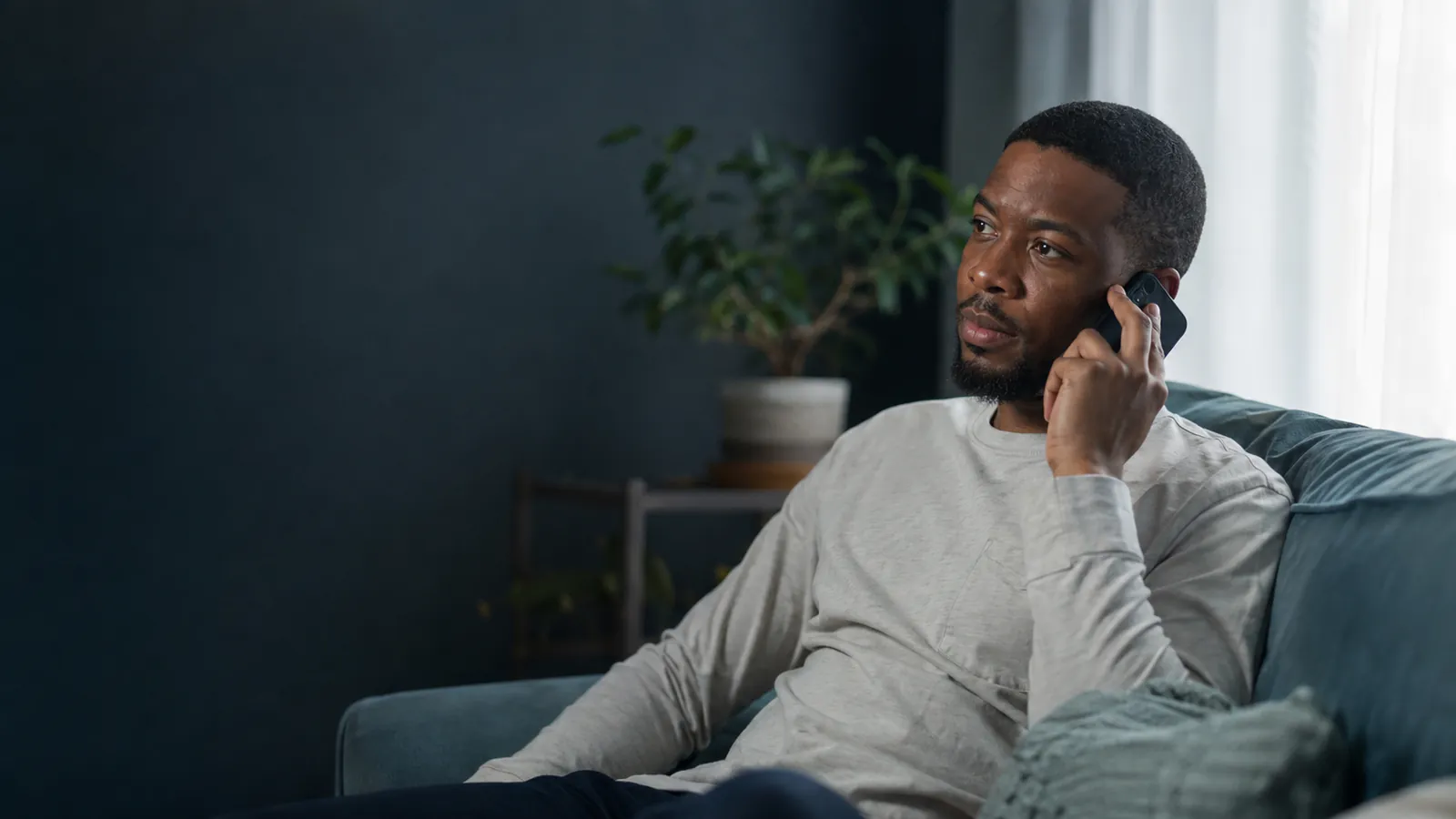 An adult making a phone call while considering help for substance use An adult making a phone call while considering help for substance use