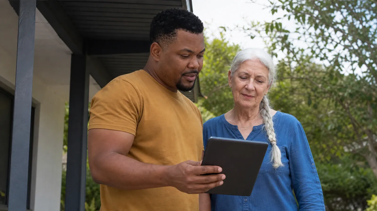 Returning Home After Treatment for Big Coppitt Key, FL Residents | Two adults look toward a tablet held with its screen… Two adults look toward a tablet held with its screen… · Returning Home After Treatment for Big Coppitt Key, FL Residents