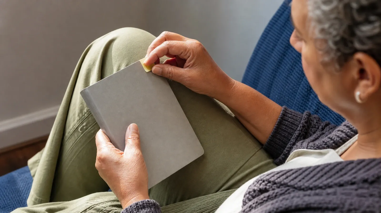 Methamphetamine Addiction Treatment for Big Pine Key, FL | An adult attaches a blank sticky tab to a closed notebook… An adult attaches a blank sticky tab to a closed notebook… · Methamphetamine Addiction Treatment for Big Pine Key, FL