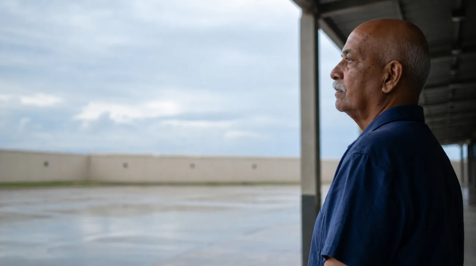 Addiction Treatment for Coconut Creek, FL Residents | An older adult stands in profile beneath a covered passage, looking… An older adult stands in profile beneath a covered passage, looking… · Addiction Treatment for Coconut Creek, FL Residents