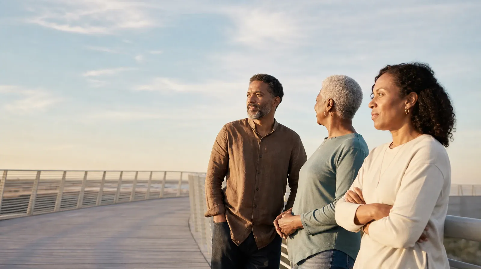 Planning Time Away for Treatment for Davie, FL Residents | Three adults pause near an anonymous pedestrian bridge Three adults pause near an anonymous pedestrian bridge · Planning Time Away for Treatment for Davie, FL Residents