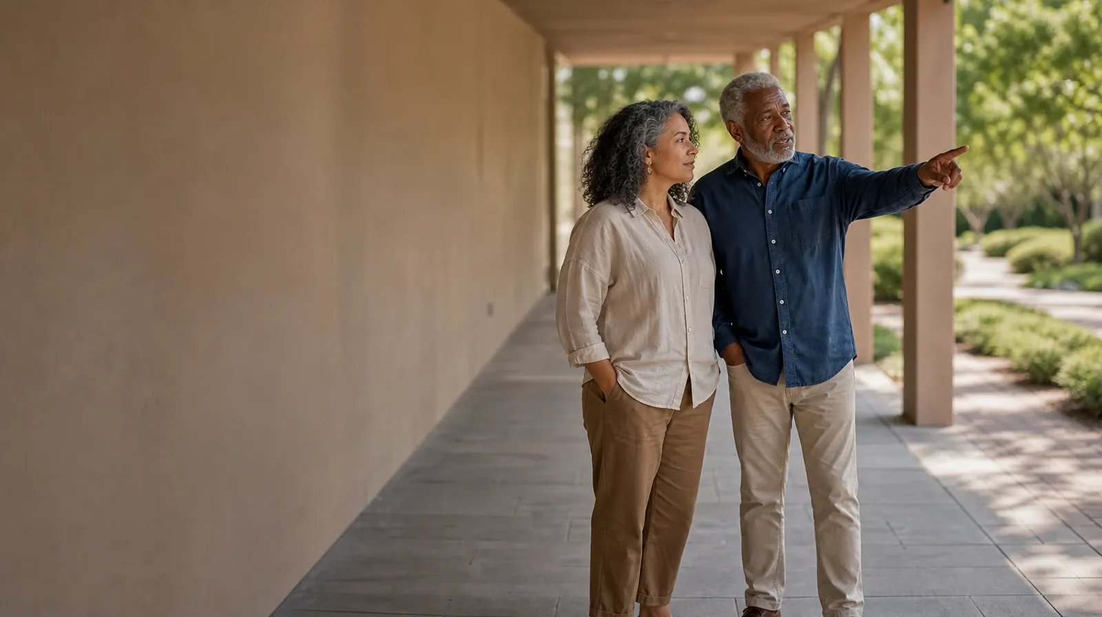 Two adults talk beneath a covered walkway · Supporting an Adult Loved One for Fort Lauderdale, FL Residents