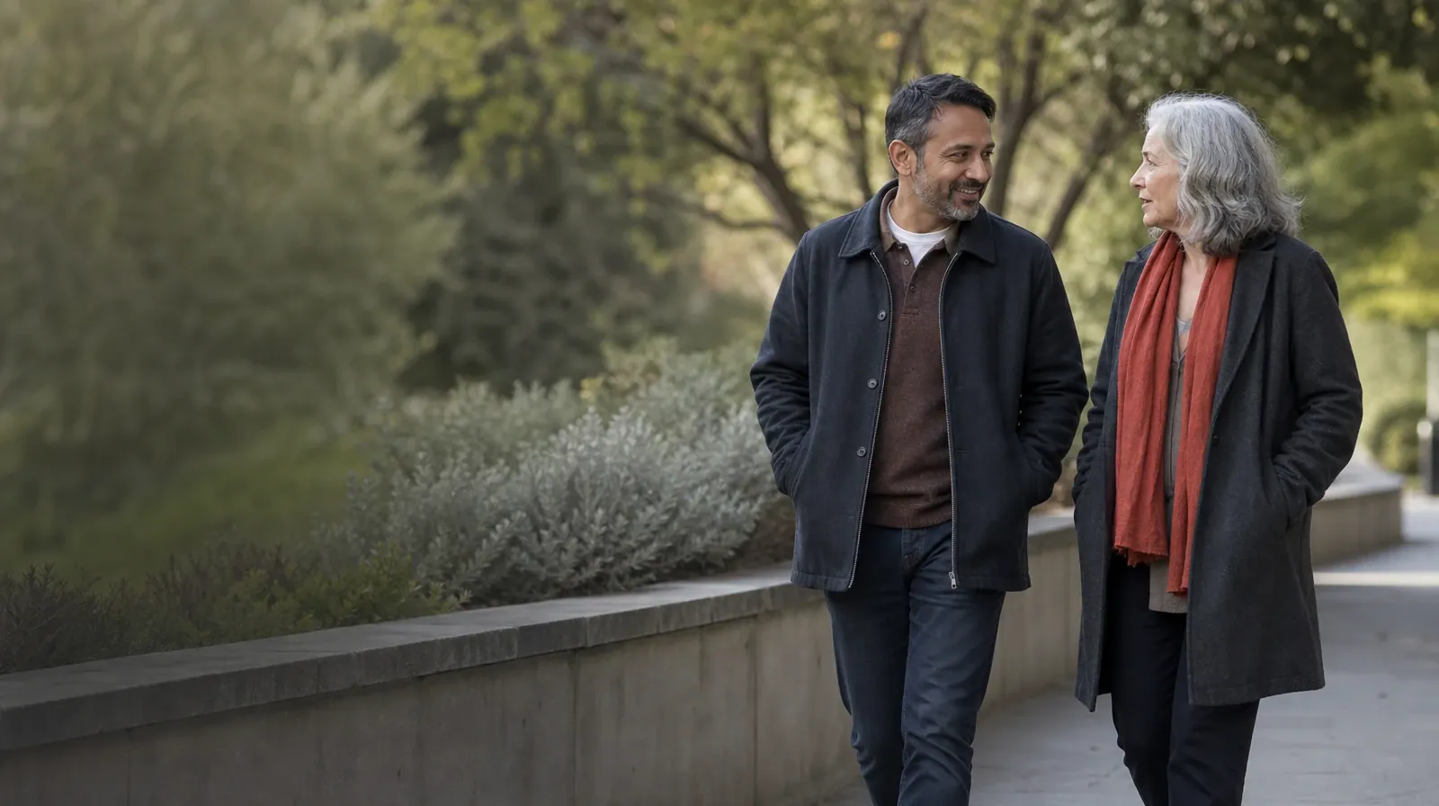 Addiction Treatment for Brickell, Miami, FL Residents | Two adults walk and talk beside a garden wall Two adults walk and talk beside a garden wall · Addiction Treatment for Brickell, Miami, FL Residents