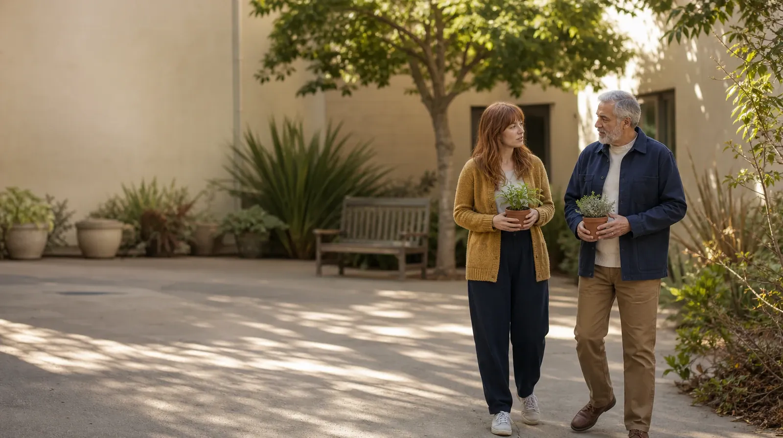 Addiction Treatment for Miami Lakes, FL Residents | Two adults pause with small plants in a courtyard Two adults pause with small plants in a courtyard · Addiction Treatment for Miami Lakes, FL Residents