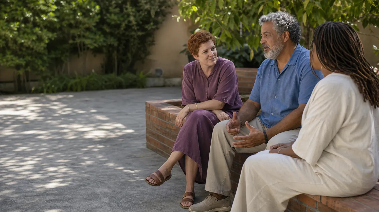 Polysubstance use Addiction Treatment for Shenandoah, Miami, FL | Three adults sit along an L-shaped brick bench, turned… Three adults sit along an L-shaped brick bench, turned… · Polysubstance use Addiction Treatment for Shenandoah, Miami, FL
