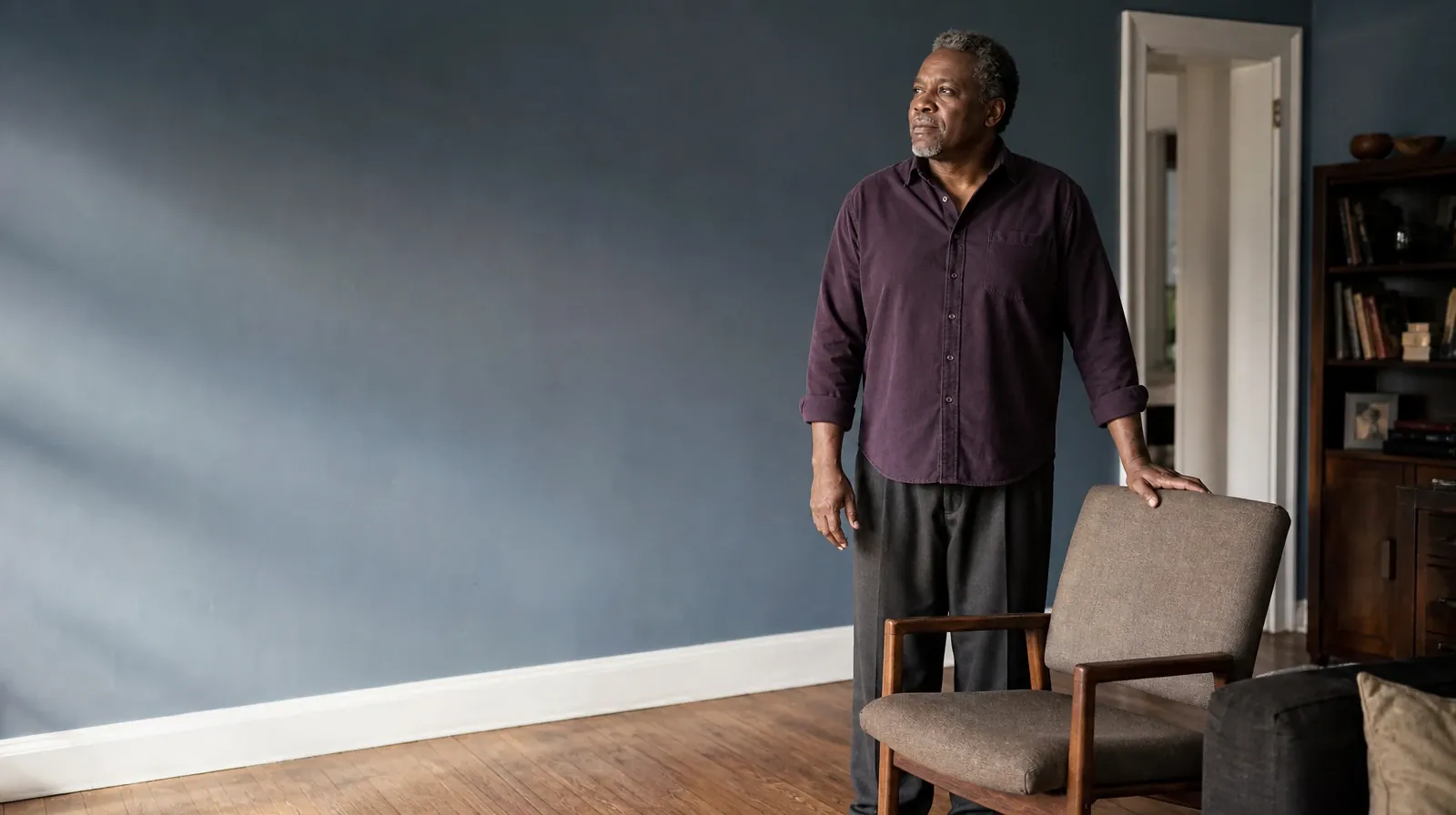 An adult stands beside a chair with one hand resting on… · Polysubstance Addiction Treatment for Upper Eastside, Miami, FL