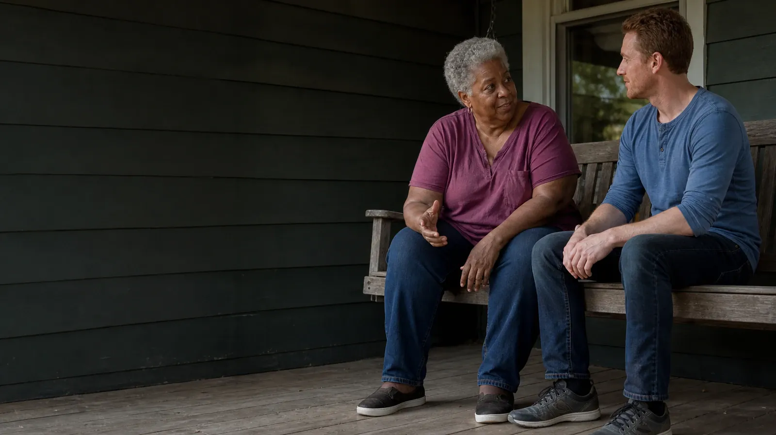 Planning a Treatment Assessment for Opa-locka, FL Residents | Two adults talk quietly while seated on a wooden porch swing… Two adults talk quietly while seated on a wooden porch swing… · Planning a Treatment Assessment for Opa-locka, FL Residents