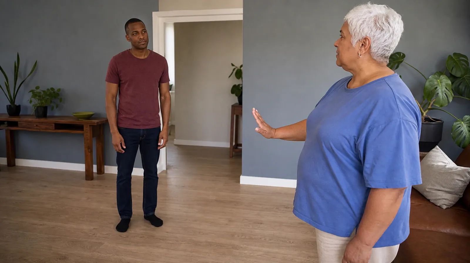 Language and Accessibility Questions for Palmetto Bay, FL | An adult makes a small raised-palm gesture while another adult… An adult makes a small raised-palm gesture while another adult… · Language and Accessibility Questions for Palmetto Bay, FL