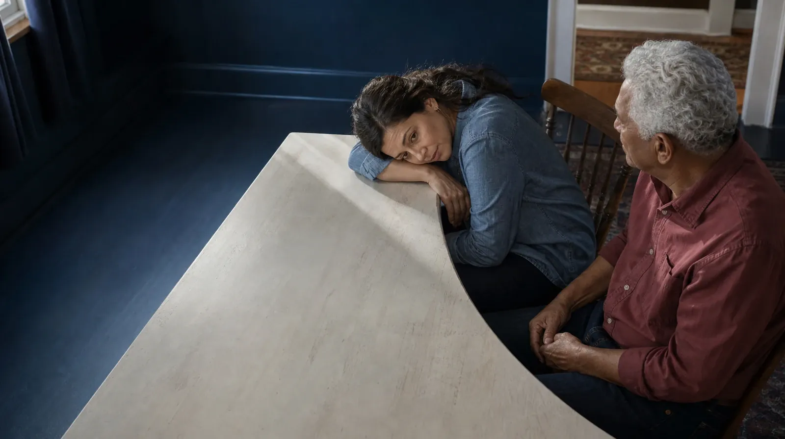 One adult rests their forehead on their own forearm at a… · Adult Recovery Support Resources for Palmetto Bay, FL Residents
