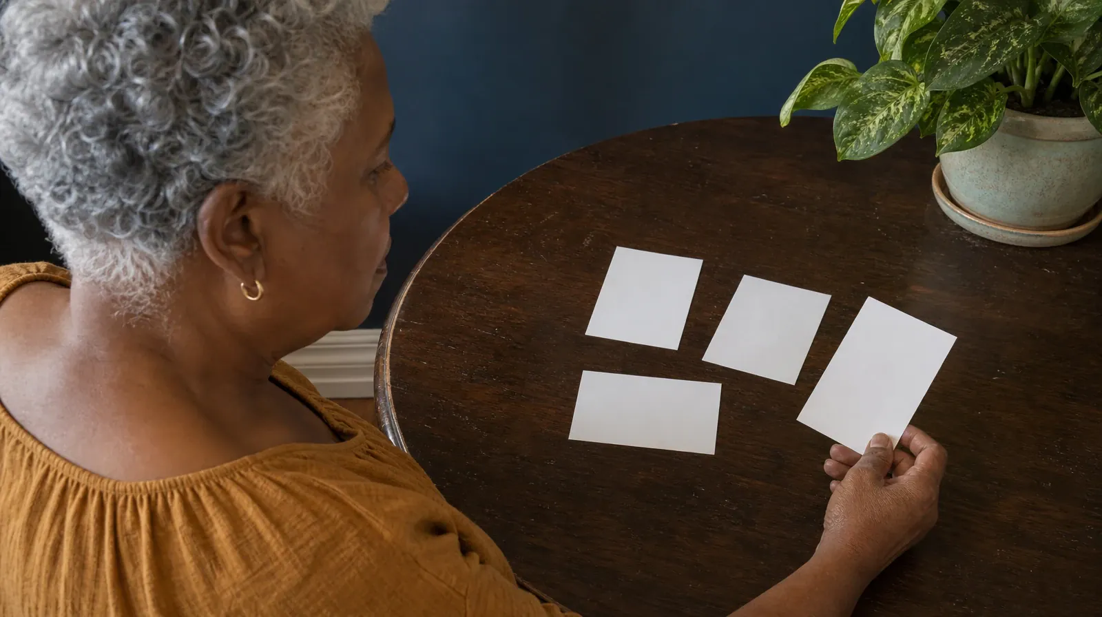 Starting a Treatment Conversation for Perrine, FL Residents | An adult holds one blank card apart from three others spread… An adult holds one blank card apart from three others spread… · Starting a Treatment Conversation for Perrine, FL Residents