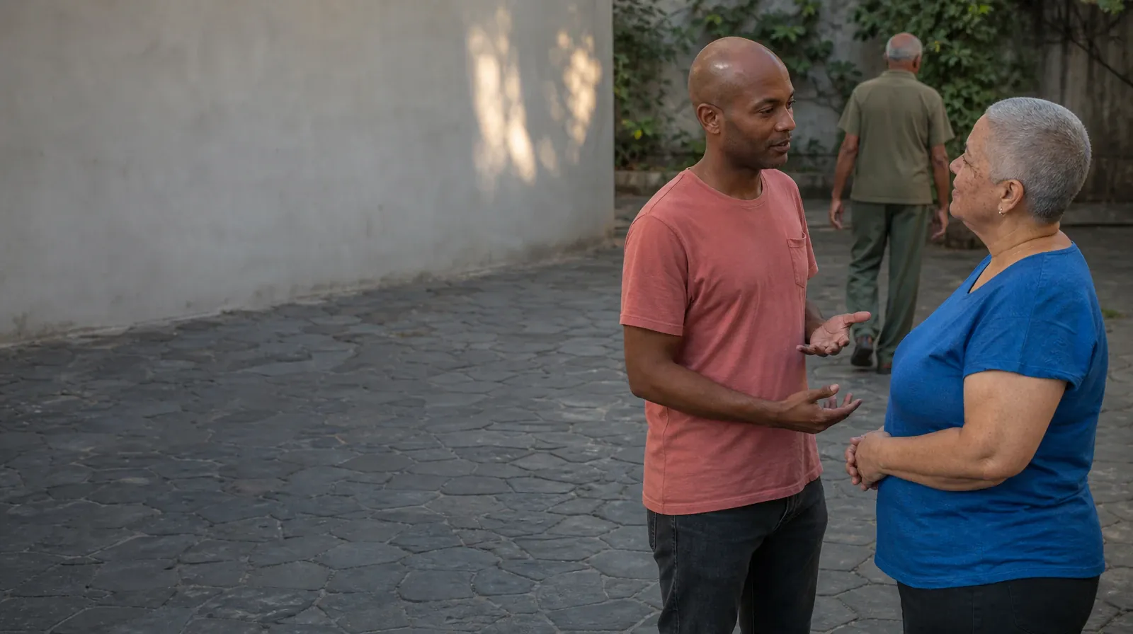 Two adults talk in a courtyard while a third adult moves a few steps… · Addiction Treatment for Pompano Beach, FL Residents