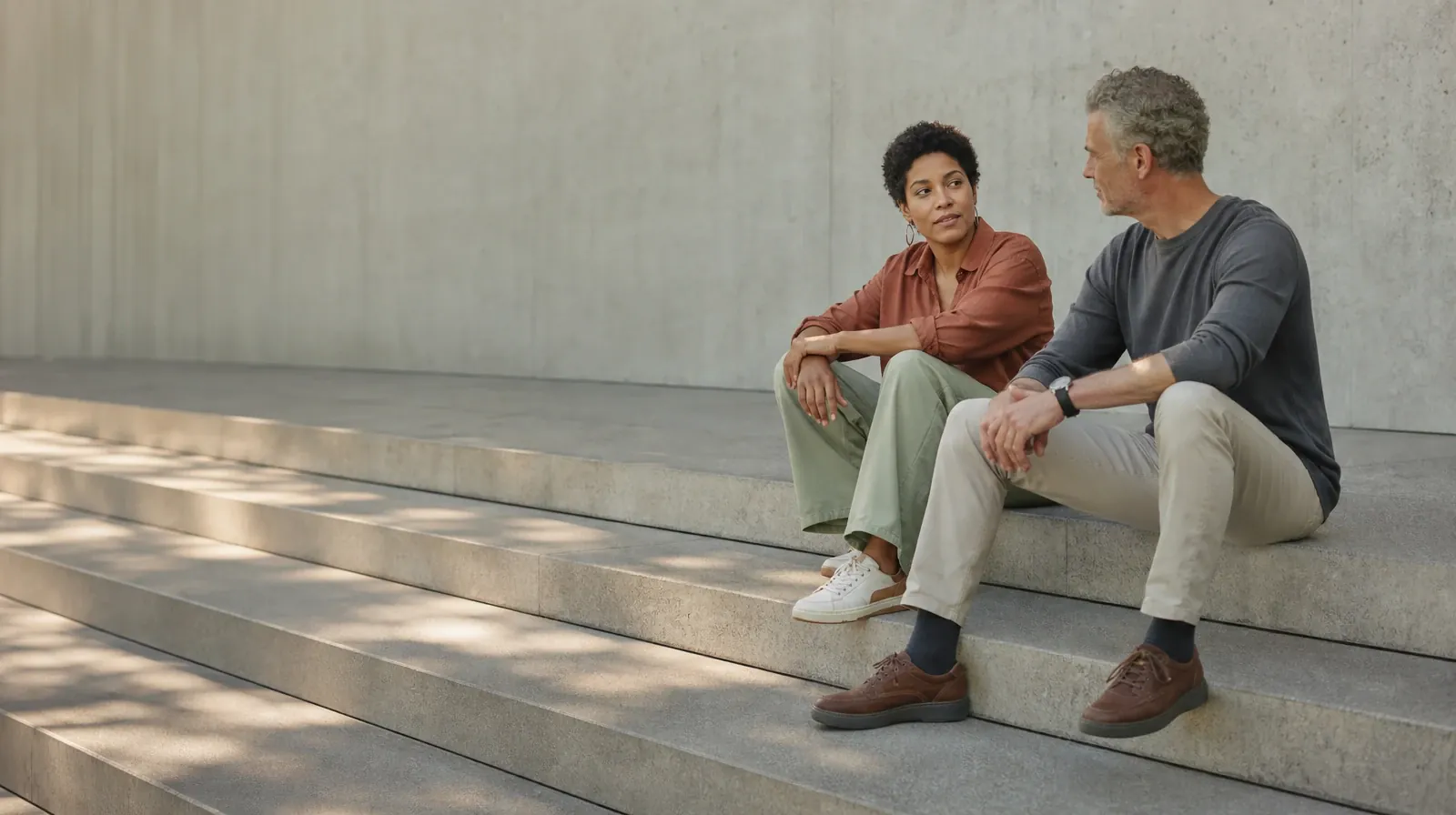 Planning Time Away for Treatment for Royal Palm Beach, FL | Two adults talk while seated on broad outdoor steps Two adults talk while seated on broad outdoor steps · Planning Time Away for Treatment for Royal Palm Beach, FL