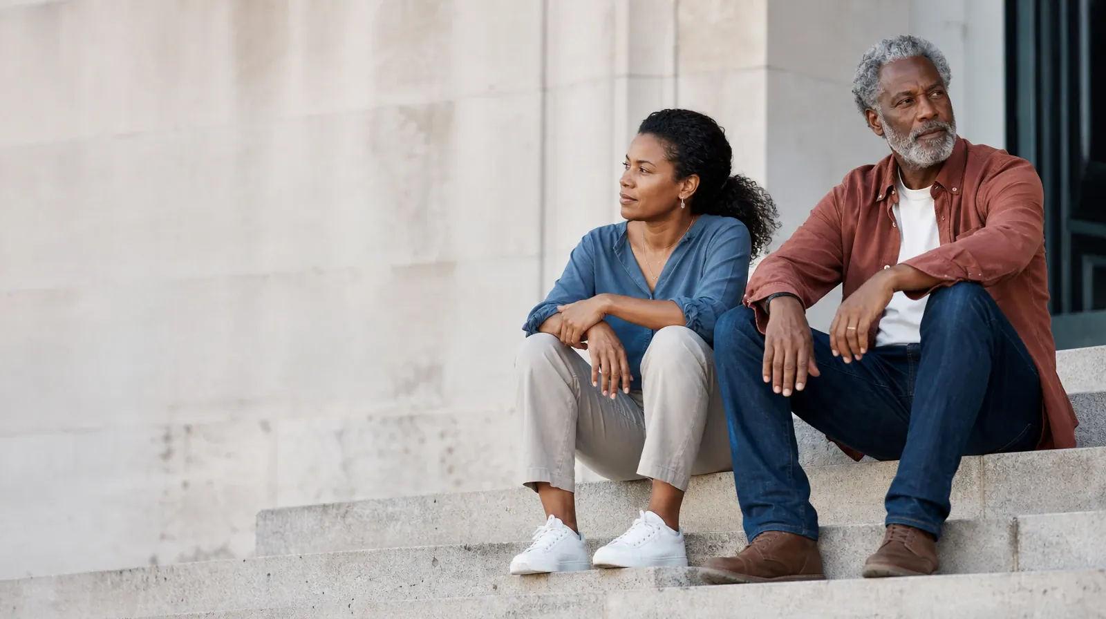 Two adults talk while seated on broad outdoor steps · Starting a Treatment Conversation for Royal Palm Beach, FL