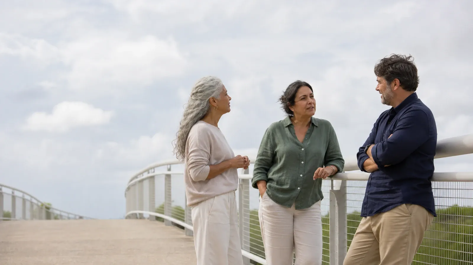 Three adults pause near an anonymous pedestrian bridge · Drug and Alcohol Detox for South Miami, FL Residents