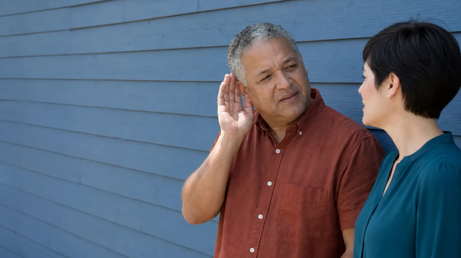 Addiction Treatment for Southwest Ranches, FL Residents | An adult loosely cups one ear while speaking with an attentive… An adult loosely cups one ear while speaking with an attentive… · Addiction Treatment for Southwest Ranches, FL Residents