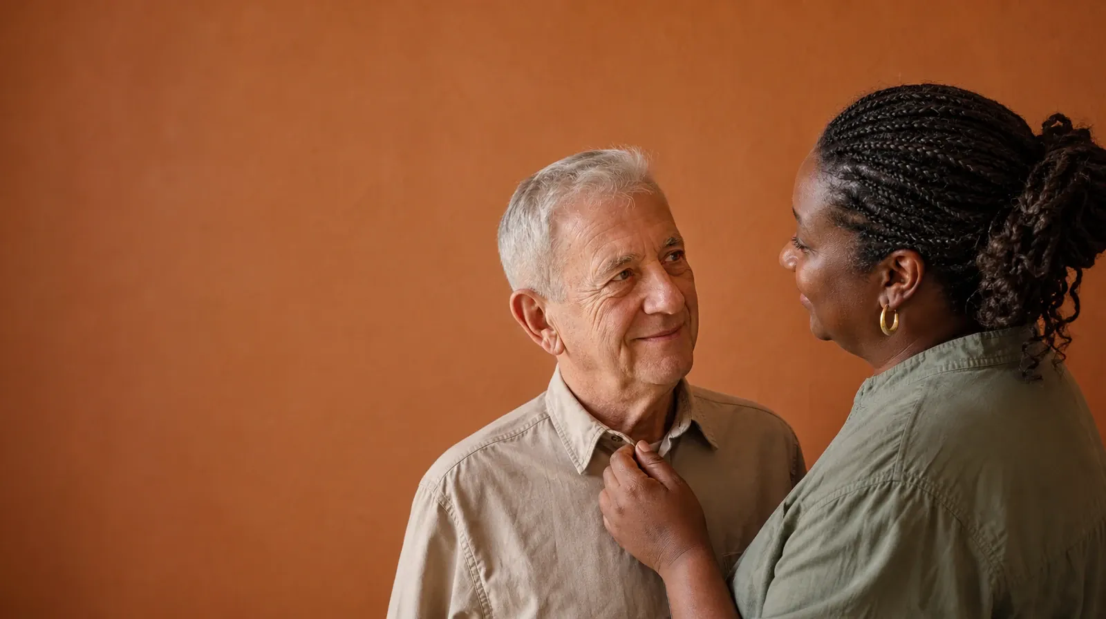 Two adults meet each other's gaze as one lightly straightens a fold in the… · Addiction Treatment for Surfside, FL Residents