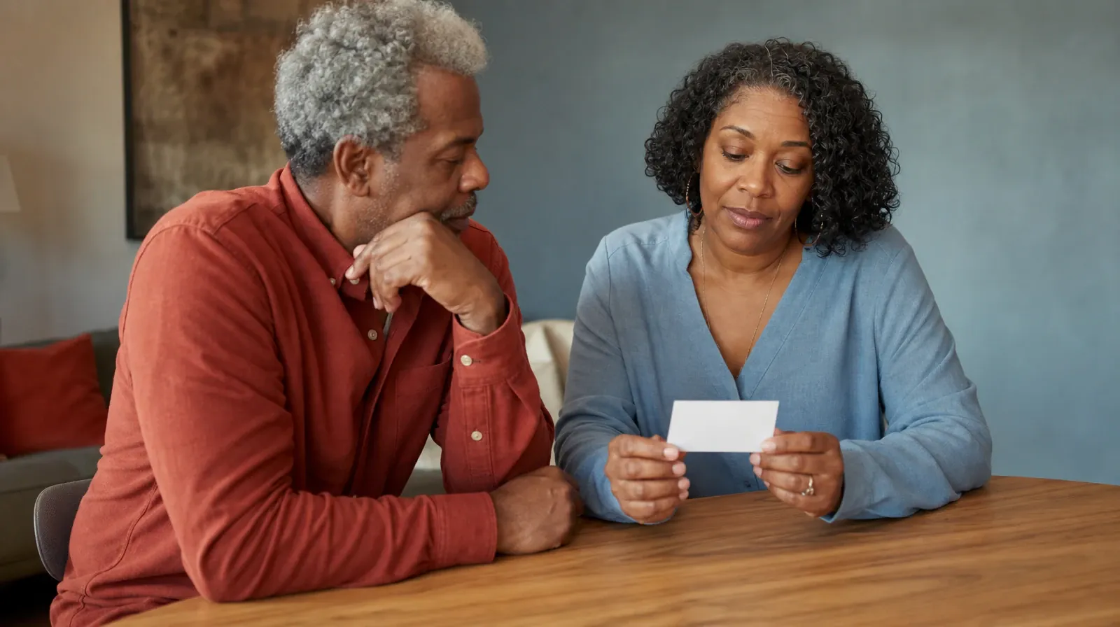 An adult holds a small blank card above a table · Planning a Treatment Assessment for Westchester, FL Residents