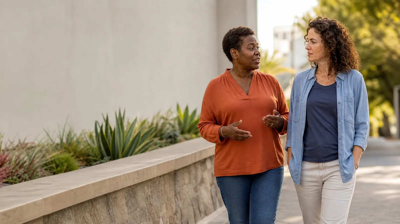 Drug and Alcohol Detox for Weston, FL Residents | Two adults walk and talk beside a garden wall Two adults walk and talk beside a garden wall · Drug and Alcohol Detox for Weston, FL Residents