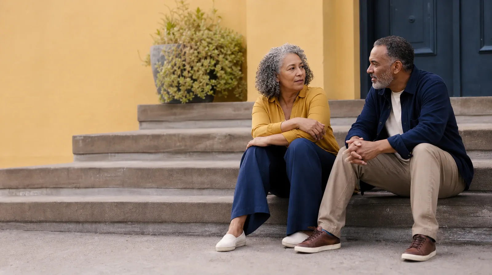 Reviewing a Care Recommendation for Codeine Use in South Florida | Two adults talk while seated on broad outdoor steps Two adults talk while seated on broad outdoor steps · Reviewing a Care Recommendation for Codeine Use in South Florida