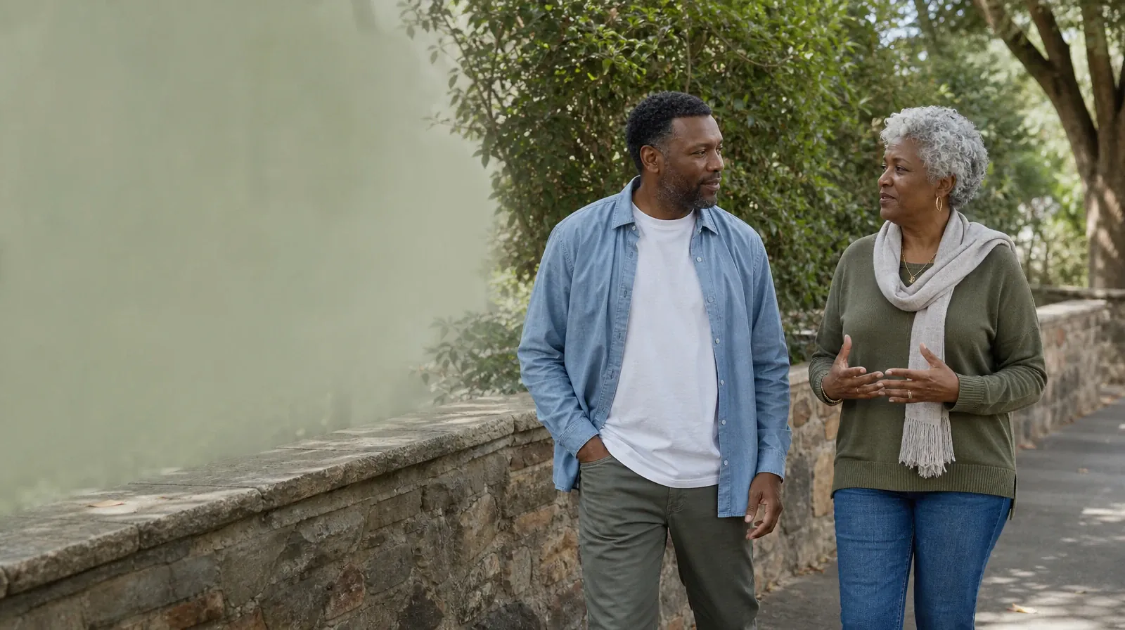 Reconnecting With Support After Fentanyl Use in South Florida | Two adults walk and talk beside a garden wall Two adults walk and talk beside a garden wall · Reconnecting With Support After Fentanyl Use in South Florida