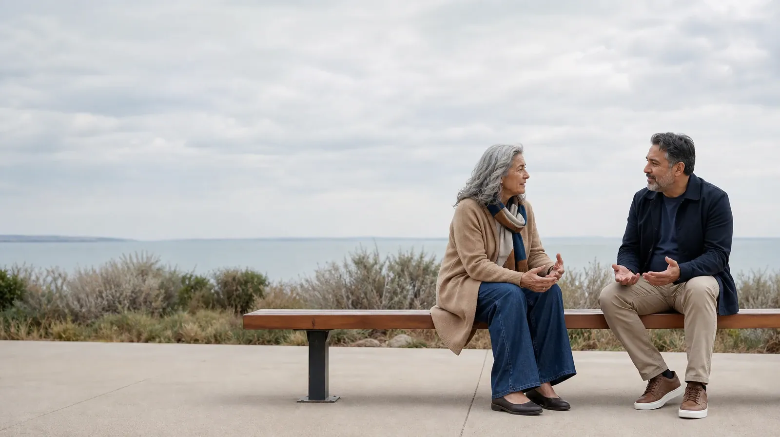 Two adults sit on an outdoor bench and talk · Telling Someone You Trust About Prescription drugs Use