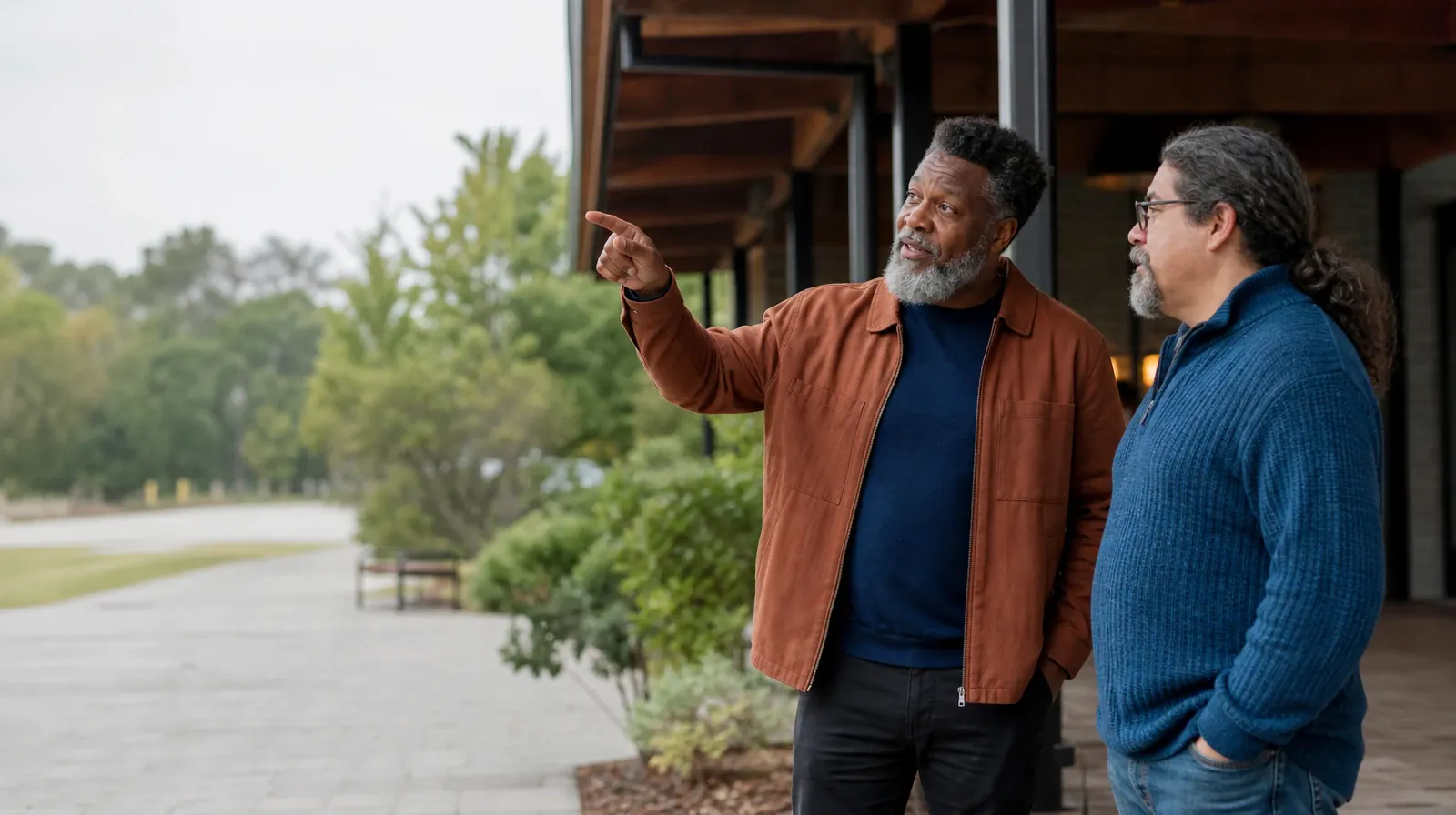Two adults talk beneath a covered walkway · Family Conversations After Treatment for Prescription opioids Use