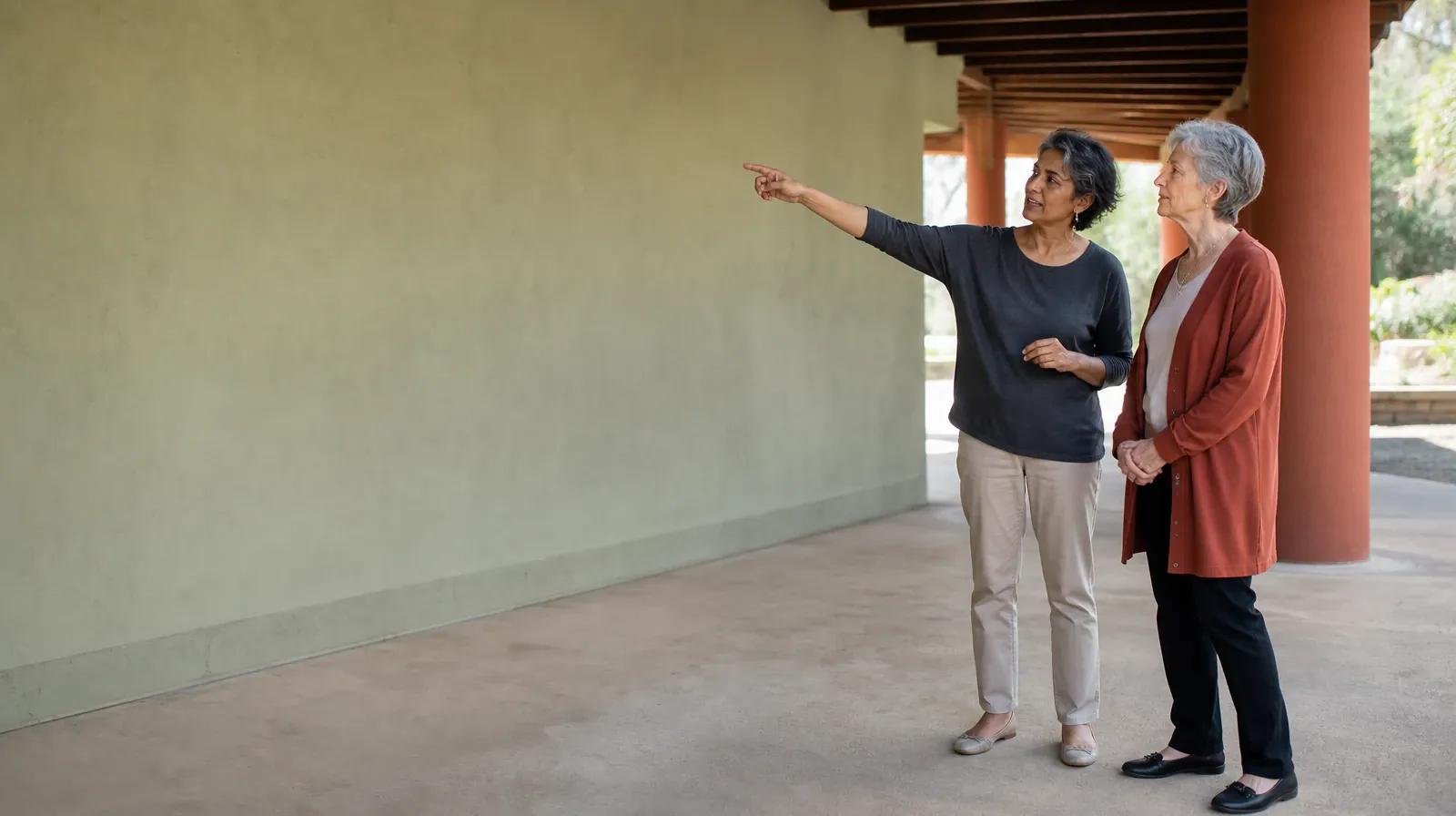 Two adults talk beneath a covered walkway · Reconnecting With Support After Ritalin Use in South Florida