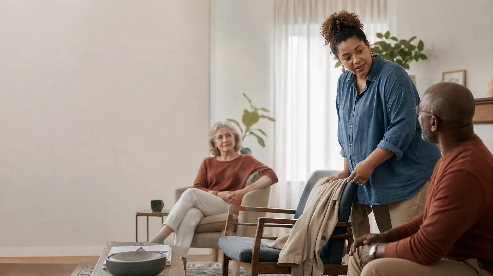 Helping an Adult Sibling With Hydrocodone Use in South Florida | An adult folds a jacket while talking with someone nearby An adult folds a jacket while talking with someone nearby · Helping an Adult Sibling With Hydrocodone Use in South Florida