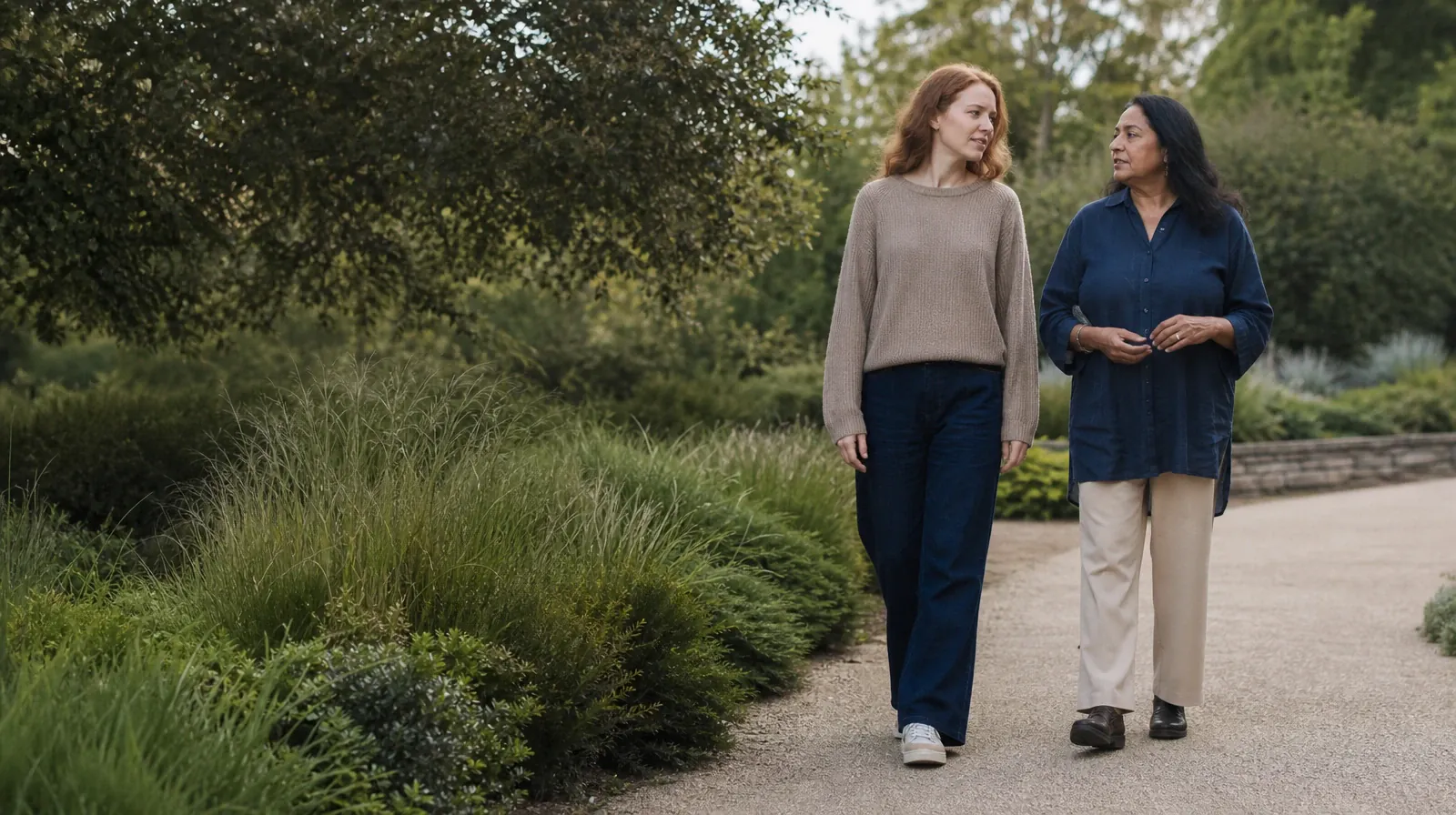 Two adults walk and talk on a quiet garden path · Supporting a Family Member With Morphine Use