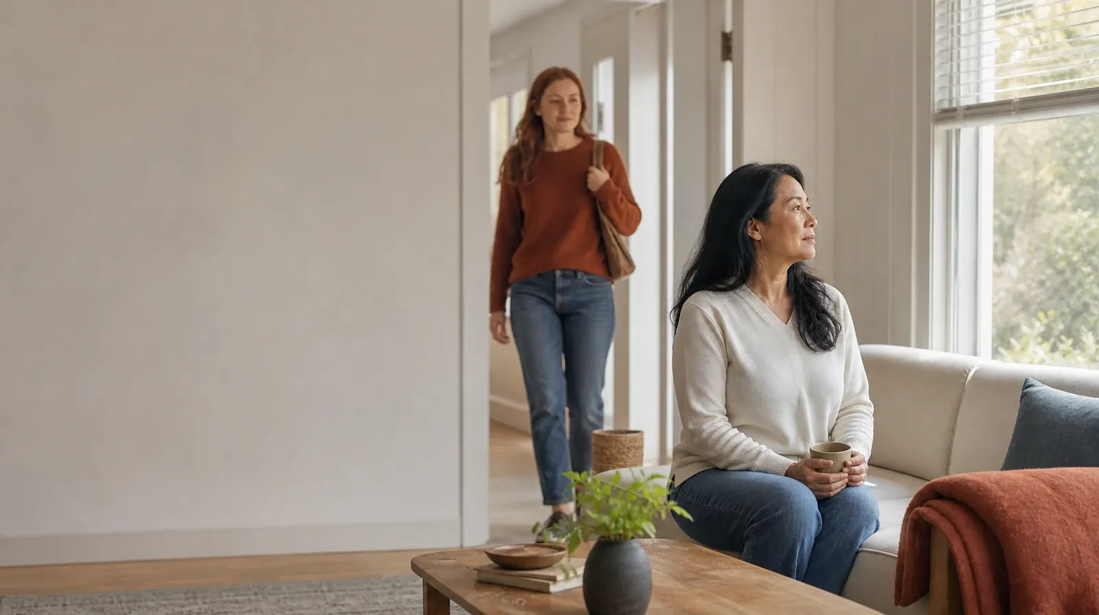 One adult sits near a window as another enters · Sleep and Recovery After Restoril Use in South Florida