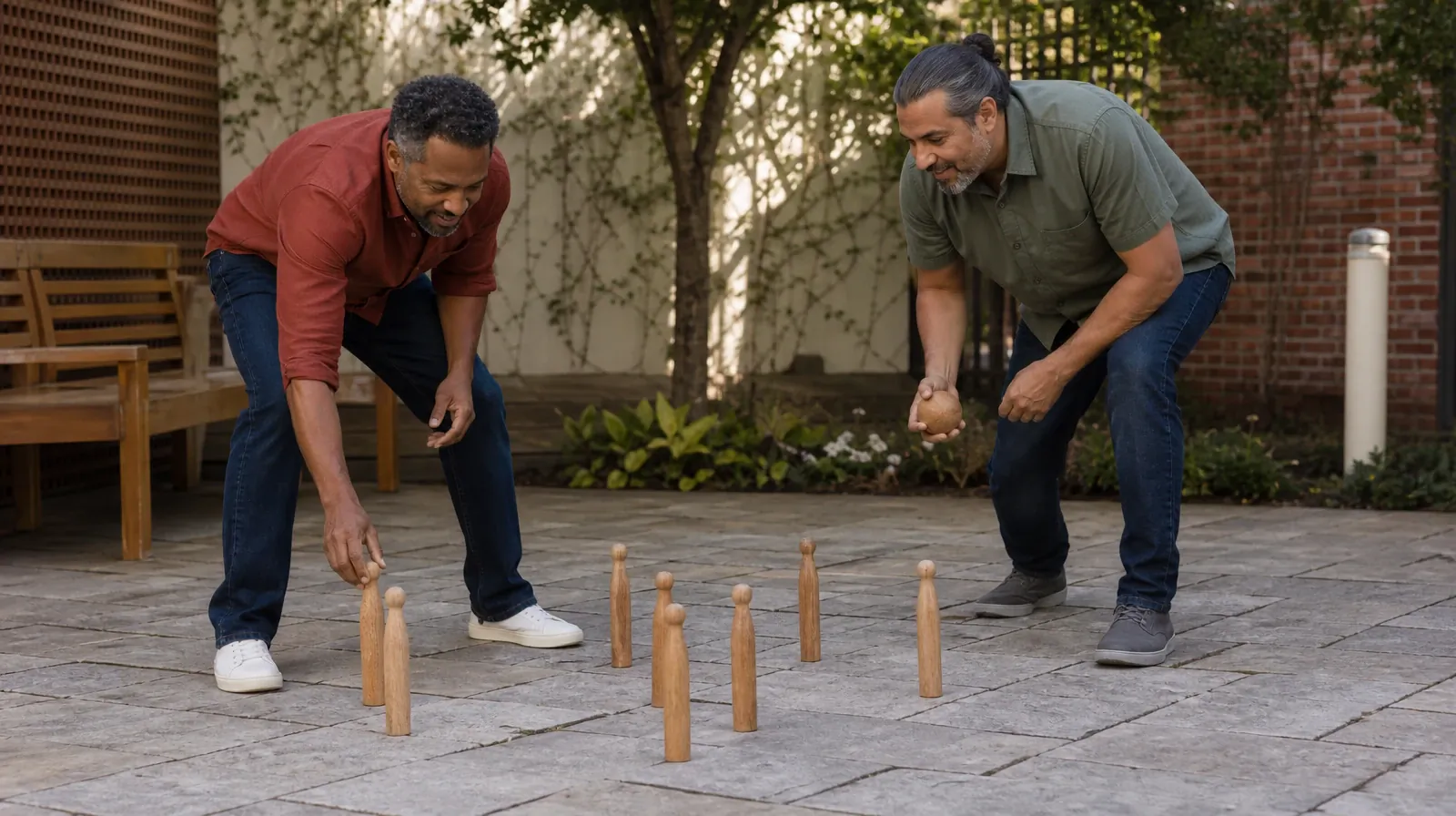 Your First Conversation About 12-step Facilitation | Two adults place wooden skittles on shaded paving before a casual game Two adults place wooden skittles on shaded paving before a casual game · Your First Conversation About 12-step Facilitation