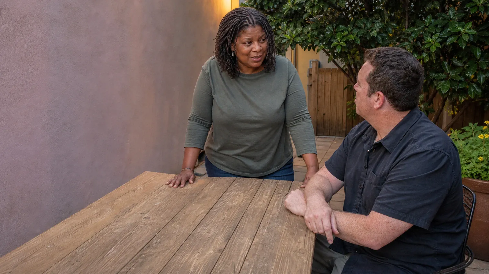 A standing adult speaks at the short end of an outdoor table while… · Previous Experience With Cognitive Behavioral Therapy