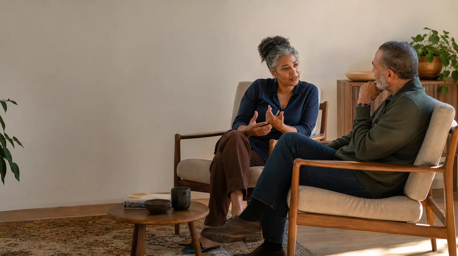 Previous Medication Treatment Education Experience | Two adults talk from separate armchairs Two adults talk from separate armchairs · Previous Medication Treatment Education Experience
