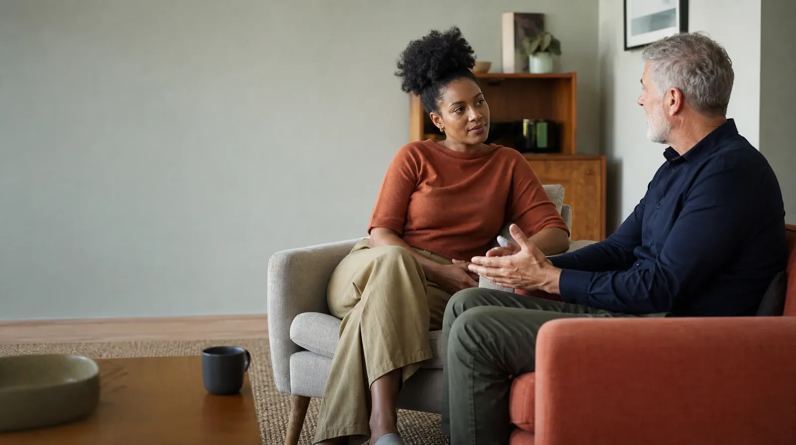 Questions About Mindfulness-Based Approaches | Two adults talk from separate armchairs Two adults talk from separate armchairs · Questions About Mindfulness-Based Approaches