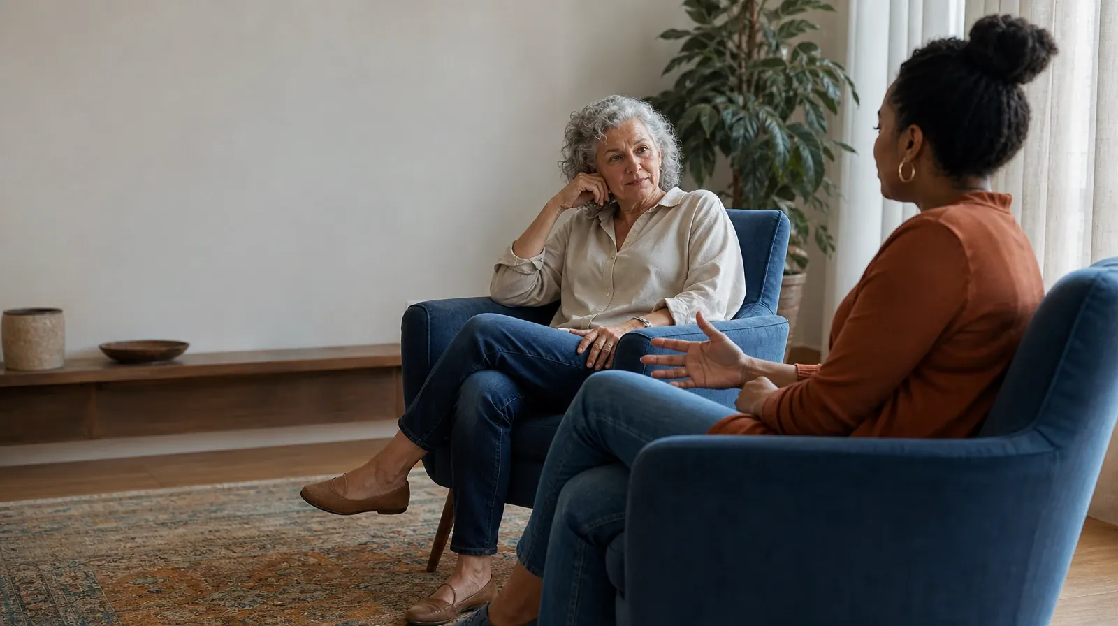 Previous Motivational Enhancement Therapy Experience | Two adults talk from separate armchairs Two adults talk from separate armchairs · Previous Motivational Enhancement Therapy Experience
