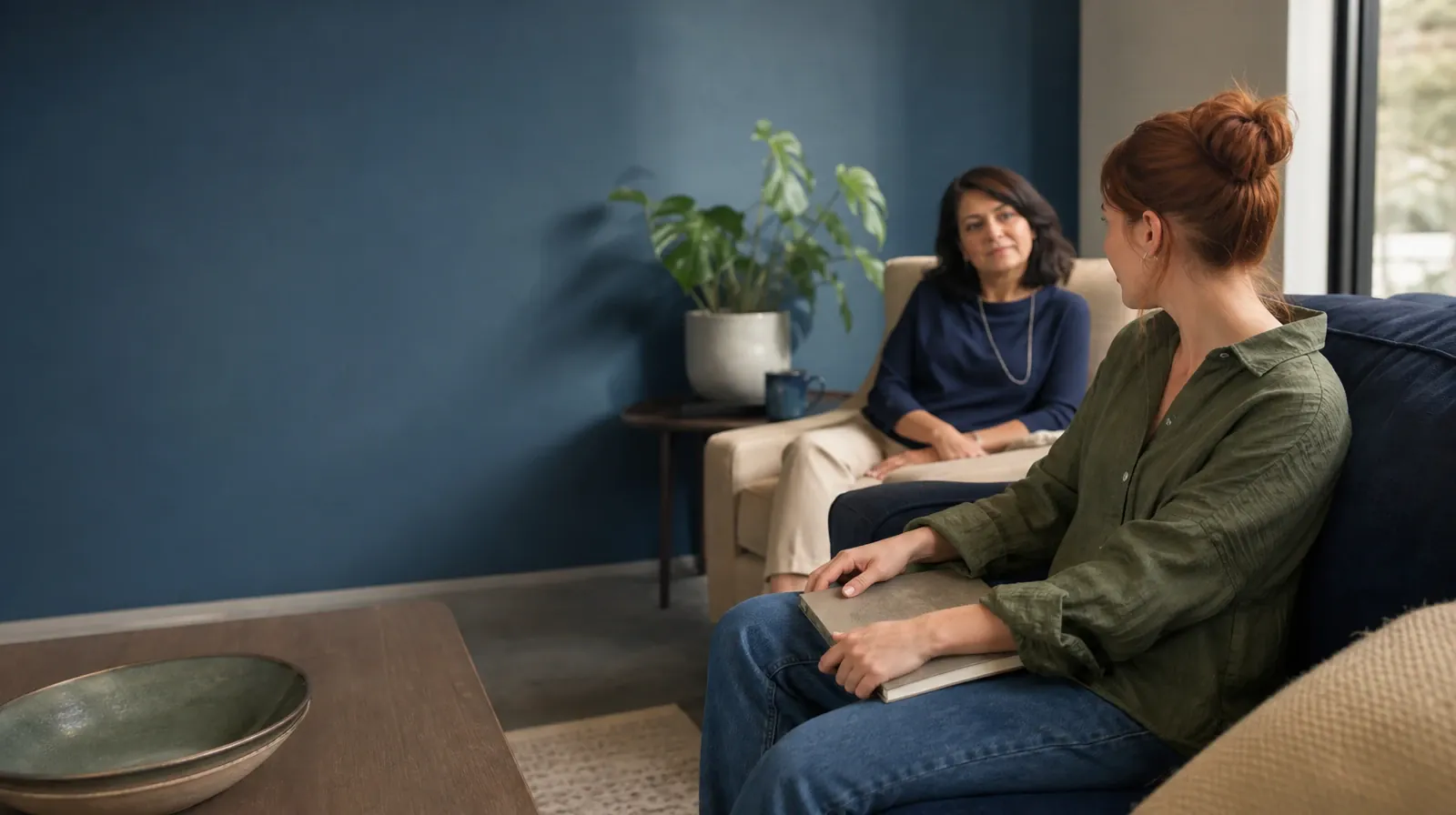 Preferences and Accessibility in Relapse Prevention | An adult closes a notebook before a conversation An adult closes a notebook before a conversation · Preferences and Accessibility in Relapse Prevention